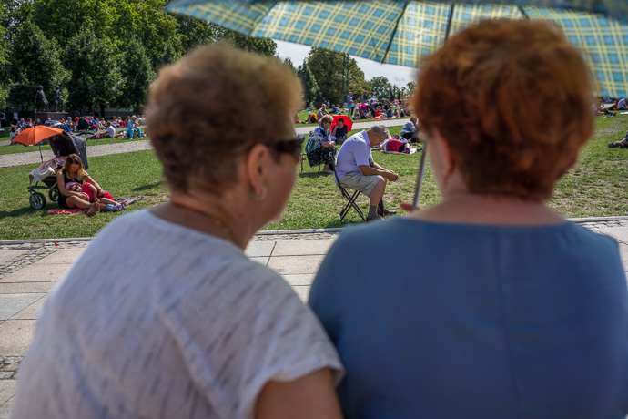 People attend the religious service held on the field in front of the Jasna Góra pilgrimage site. Image: Michel Meijer