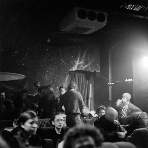 The visitors are looking for a place in the cinema's projection room, in which the beamer is explicitly visible from the ceiling. Image: Michel 