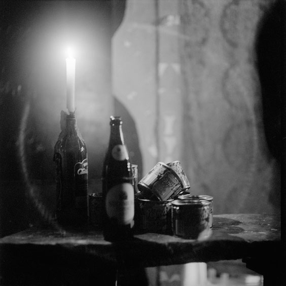 Candles and improvised ashtrays on a table in the reception area of the cinema. Image: Michel Meijer