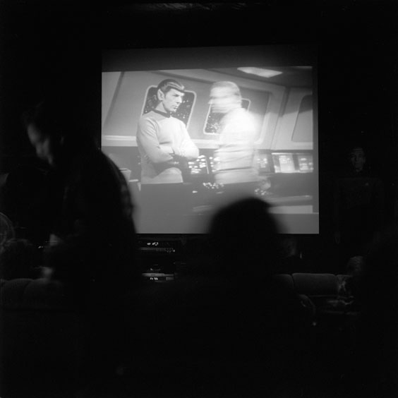 The audience seeks a seat in the cinema while an episode of Star Trek begins on the screen. Image: Michel Meijer