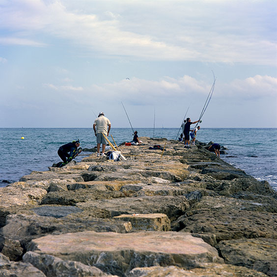 Sport fishermen on a breakwater at Pinedo Beach. Image: Michel Meijer
